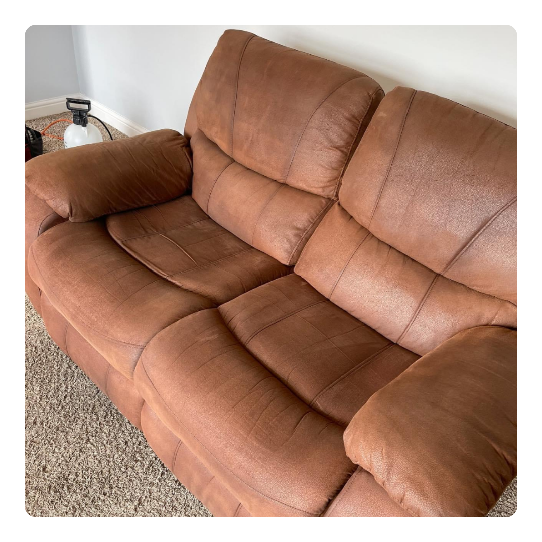 A brown leather couch featuring two comfortable recliners for ultimate relaxation and style in any living space.